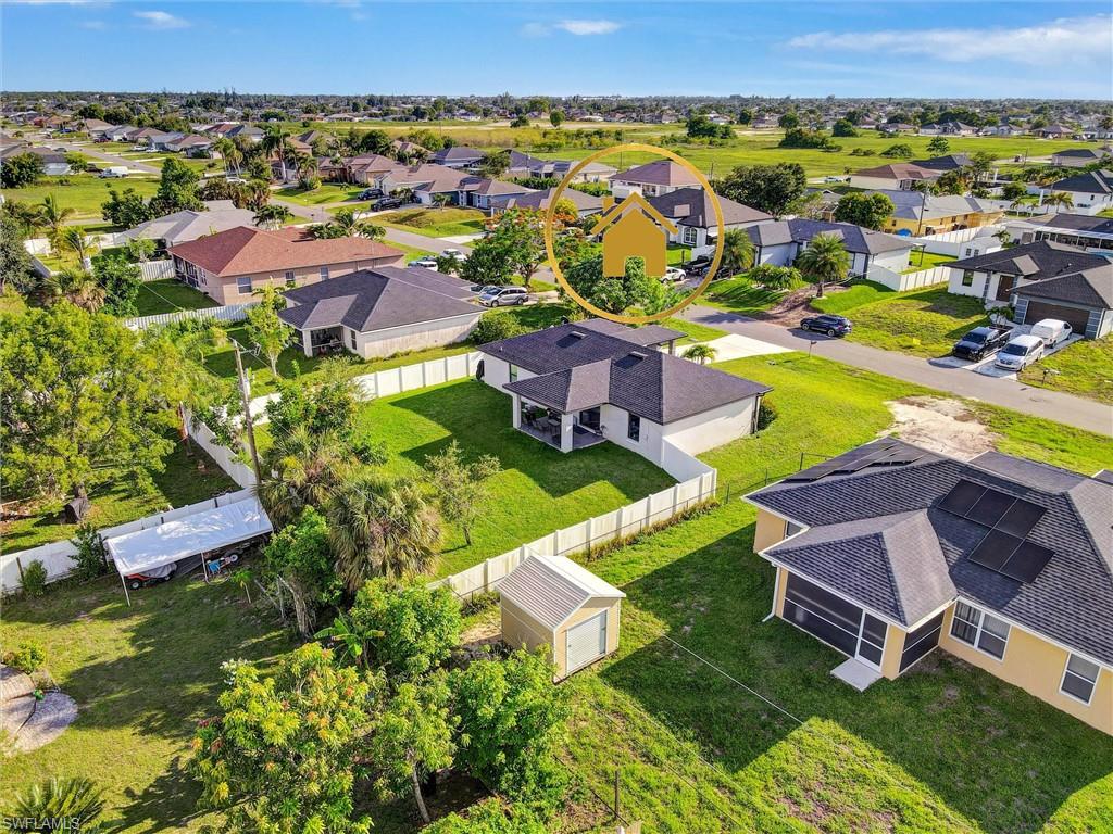 Aerial perspective of a neighborhood featuring multiple single-story residences