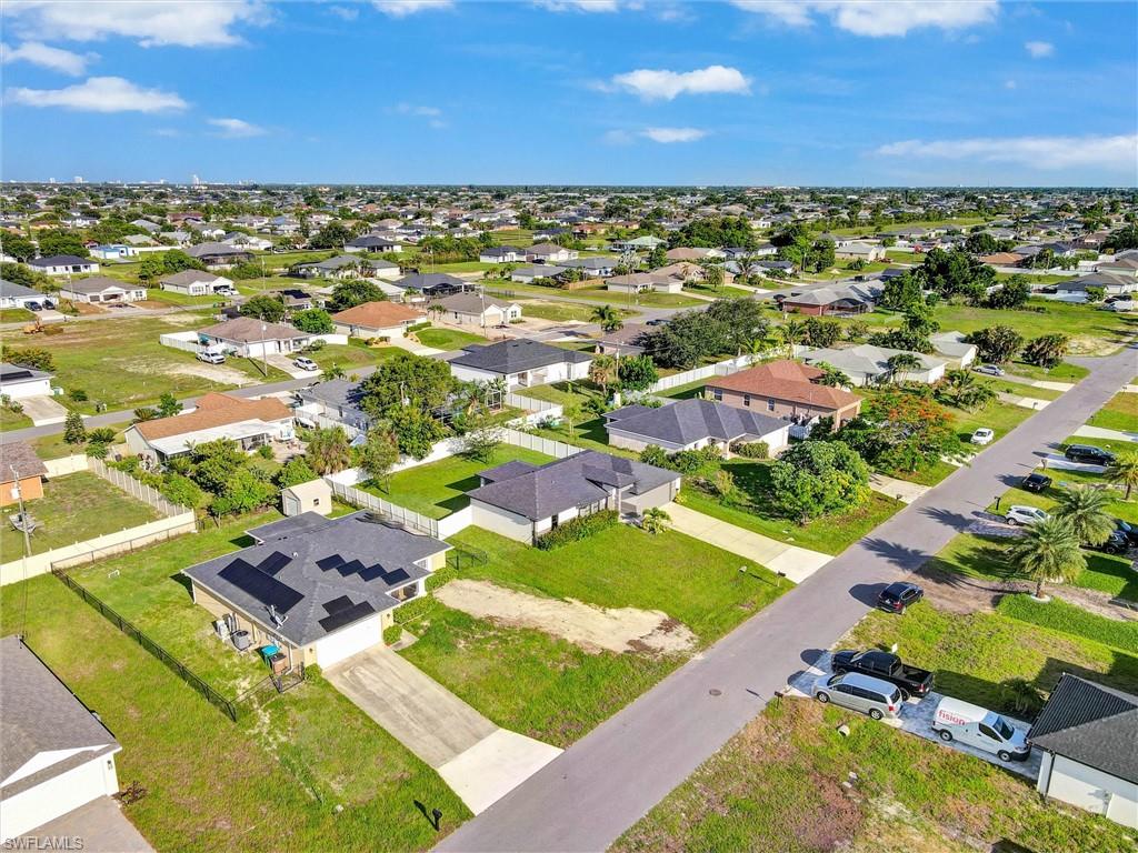 Residential neighborhood with multiple single-story homes featuring shingle roofs