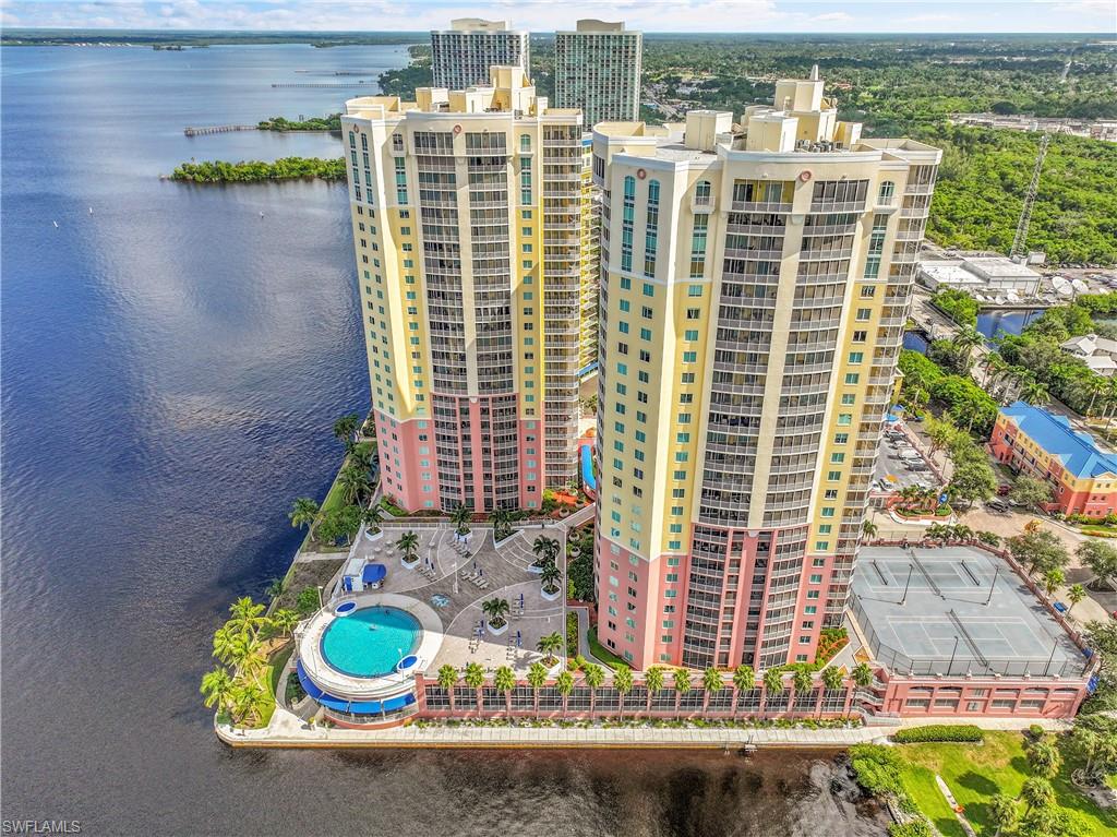 Aerial view of apartment complex and a nearby body of water