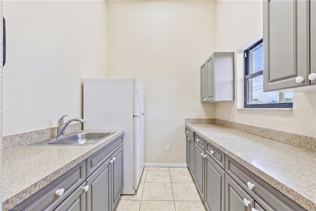 Dedicated break room with kitchen amenities designed for employee comfort and daily convenience.