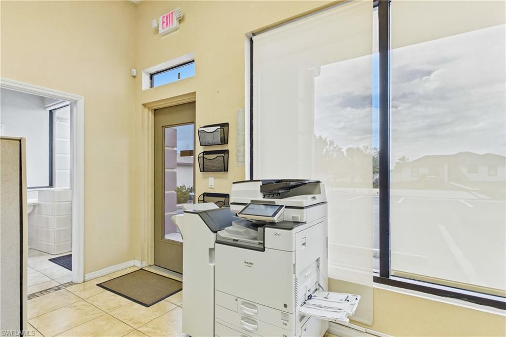 Dedicated copier and workstation area helps streamline office operations and administrative tasks.