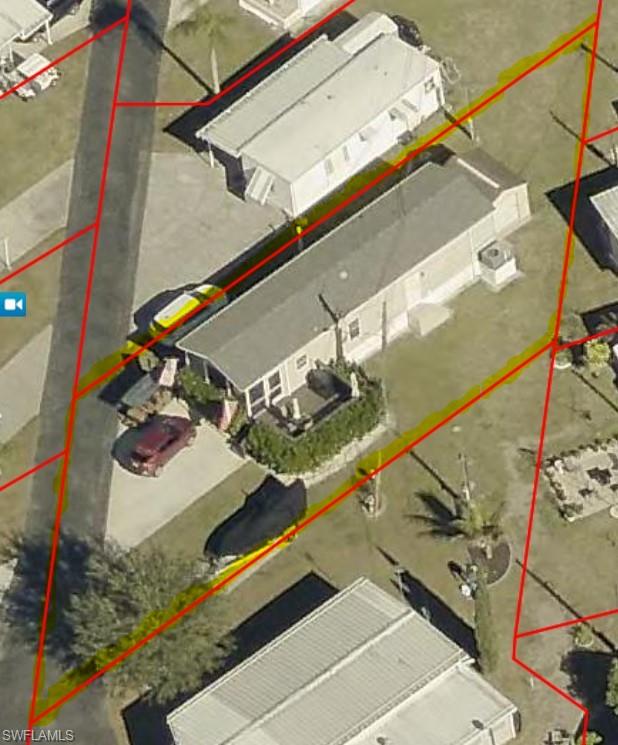 Aerial View with Property Boundary illustrating the property's perimeter and surrounding parcels