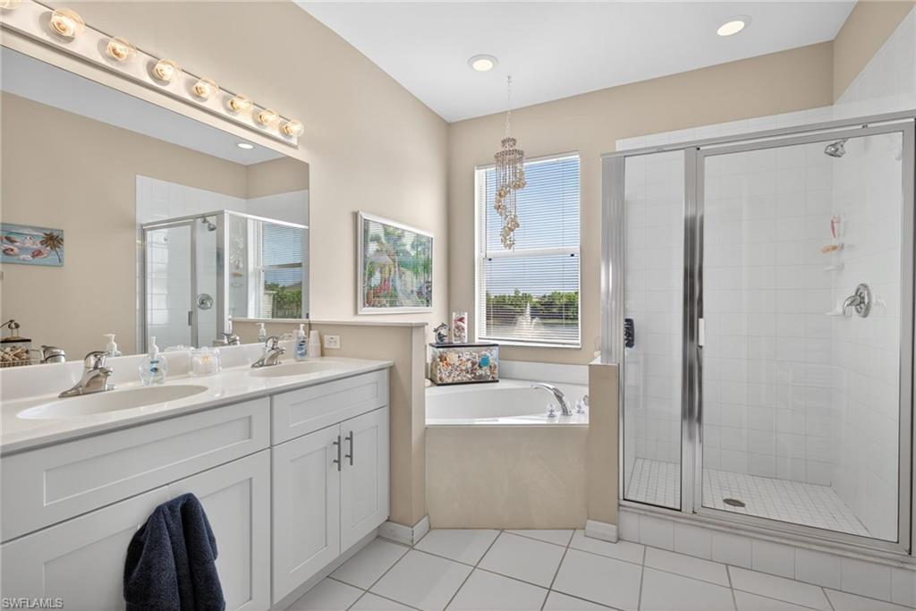 Dual vanity with undermount sinks and white shaker-style cabinetry