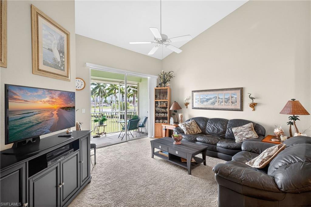 Living area with vaulted ceilings and neutral wall tones