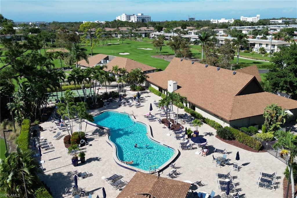 Main Community pool with golf course view and a patio area attached to the 19th Hole Restaurant