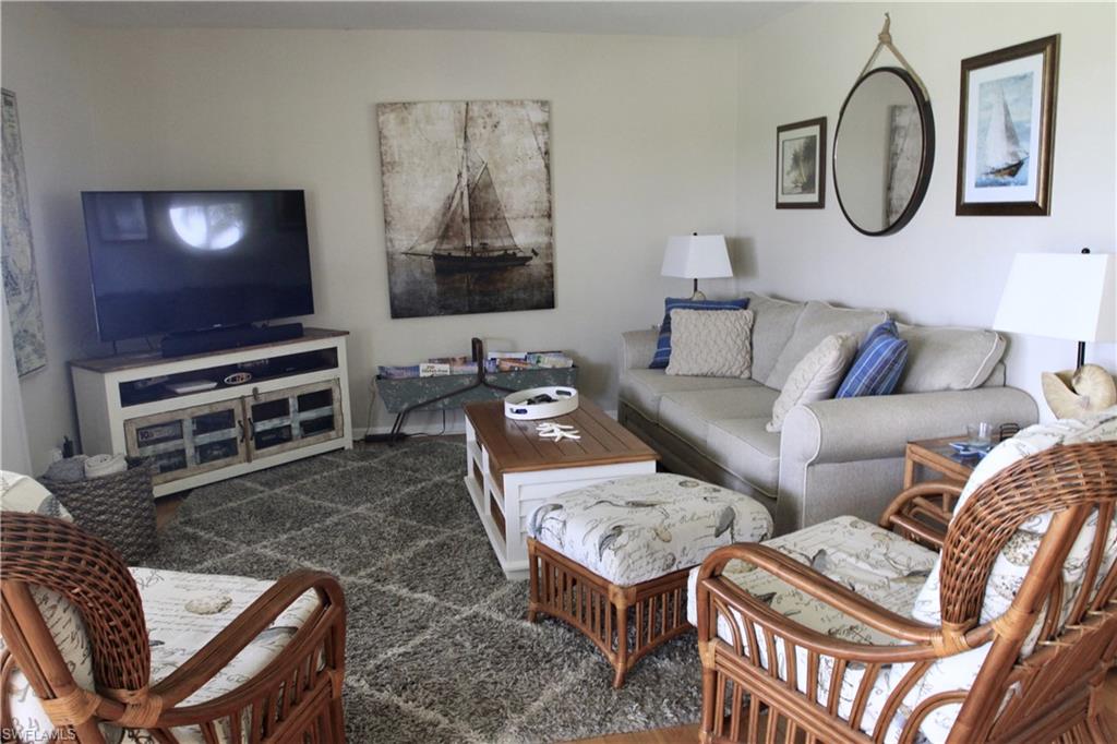 View of living area overlooking the golf course and water feature.