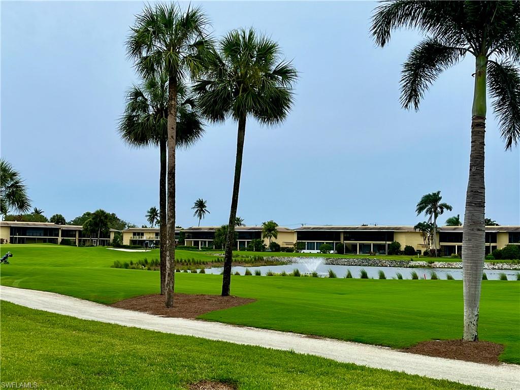 View in the back of the unit towards the golf course and pond with water feature