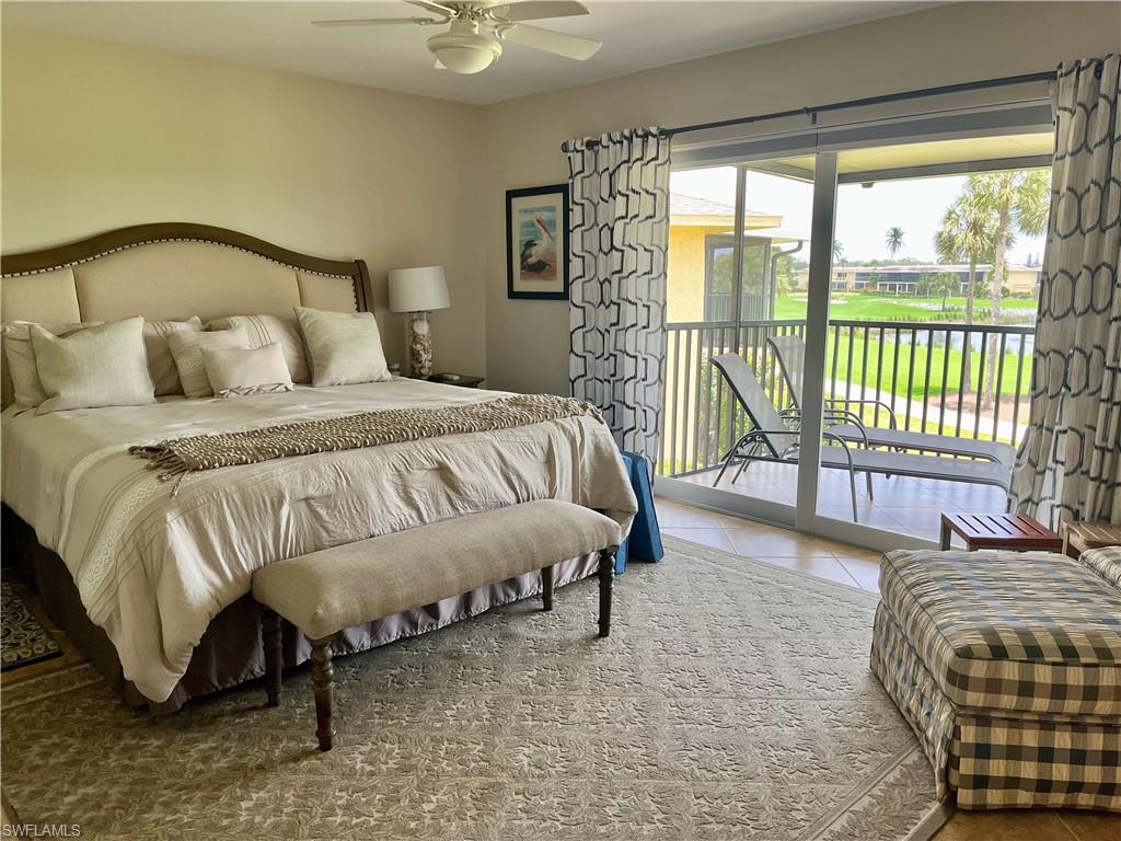Primary bedroom has a king bed with access to the large balcony with a golf course view