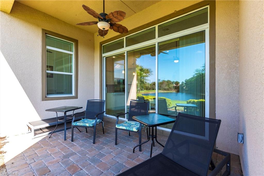 Patio featuring brick paver flooring and an outdoor ceiling fan