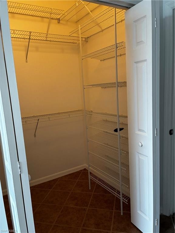 primary closet with built in shelving