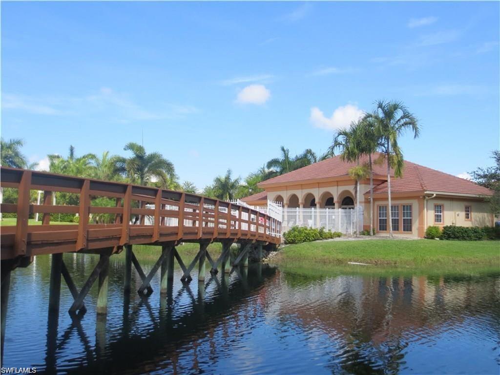 bridge across pond to the clubhouse and pool