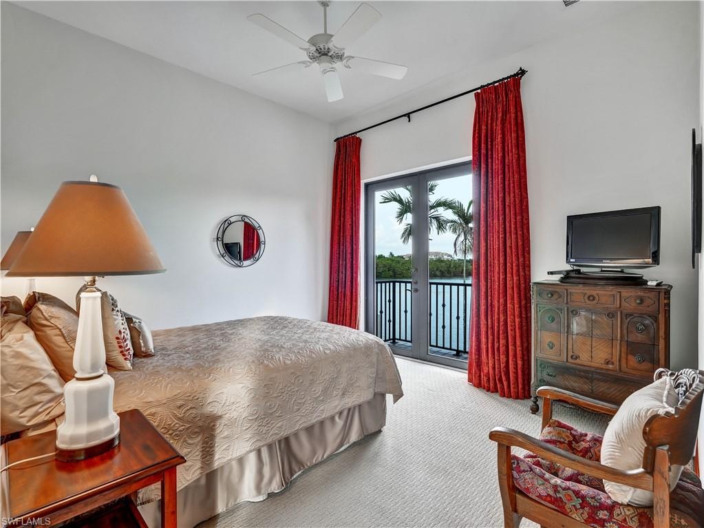 French doors opening to a balcony with water scenery