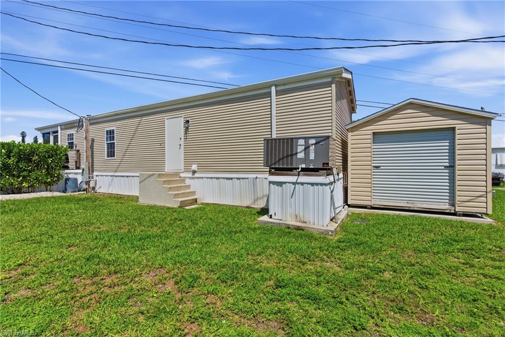 side of property with A/C and Furnace combo unit