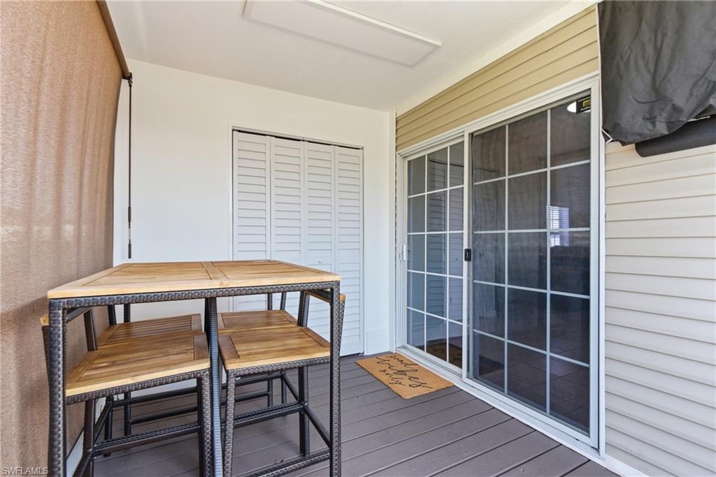 Screened Lanai with TV and sitting area and also an enclosed laundry area with storage