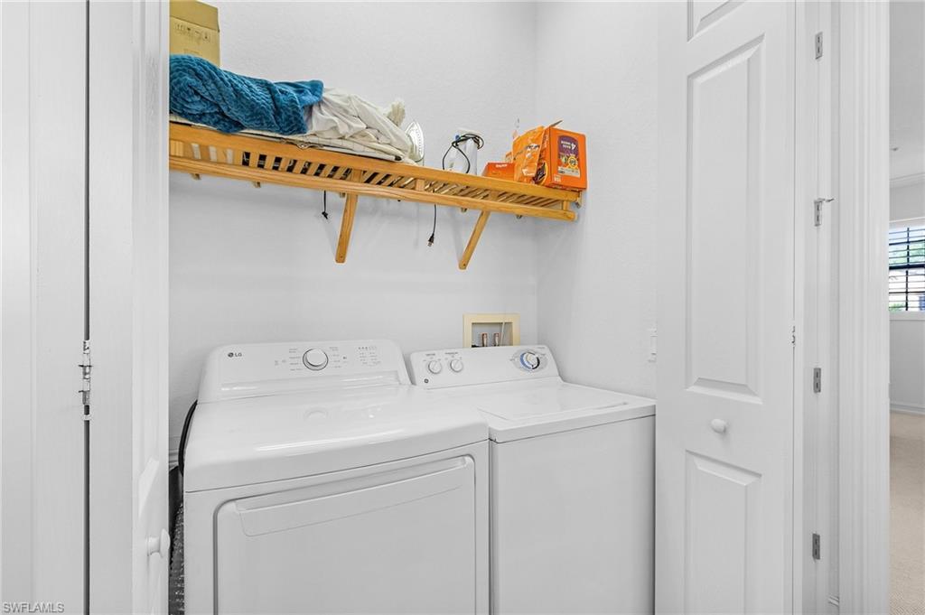 Washroom featuring independent washer and dryer