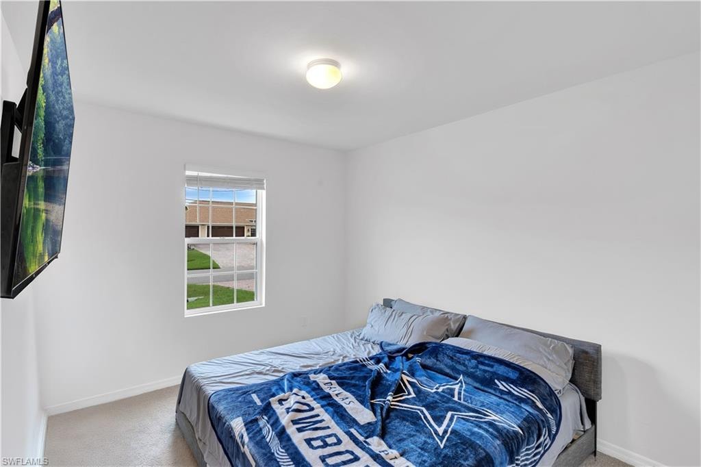Bedroom with carpet flooring