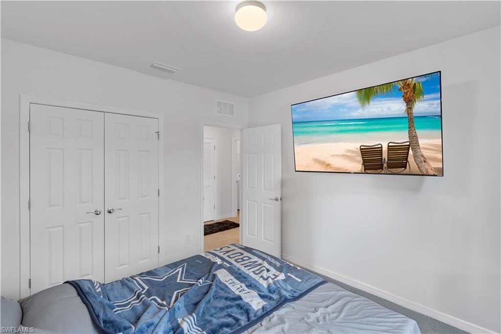 Bedroom with a closet and baseboards