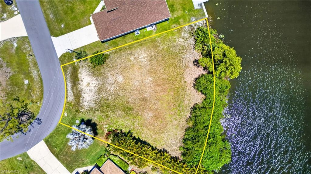 Waterfront lot with established vegetation along the water's edge