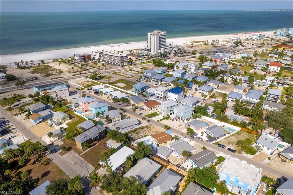 Aerial perspective showcasing a coastal community with numerous residential properties
