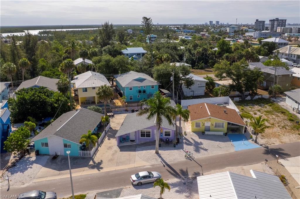 Aerial perspective showcasing multiple properties with diverse exterior finishes