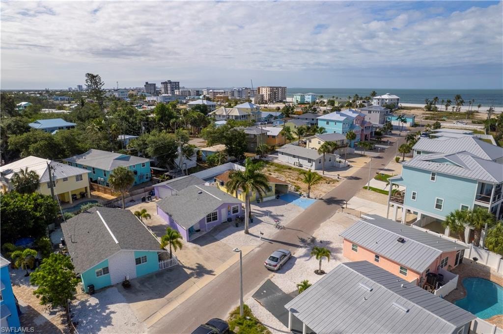Coastal neighborhood featuring a variety of single-family homes, some with elevated foundations