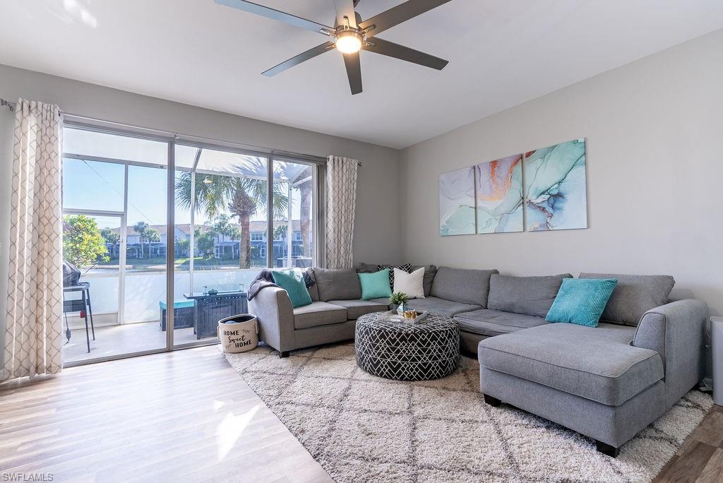 Living area featuring wood finished floors and a ceiling fan