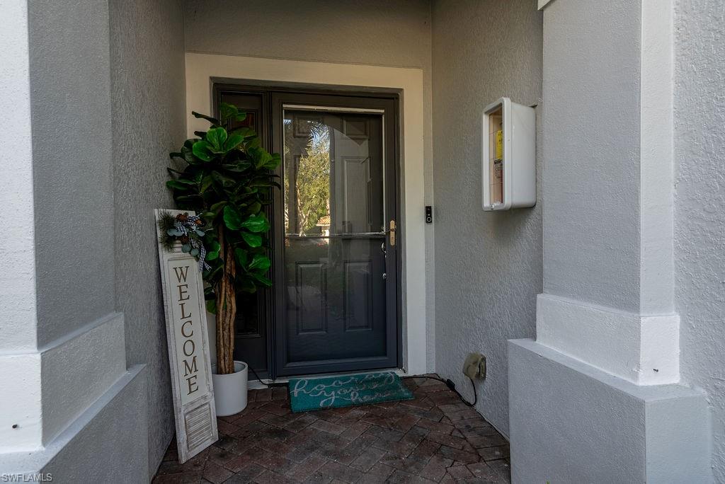 Property entrance with stucco siding
