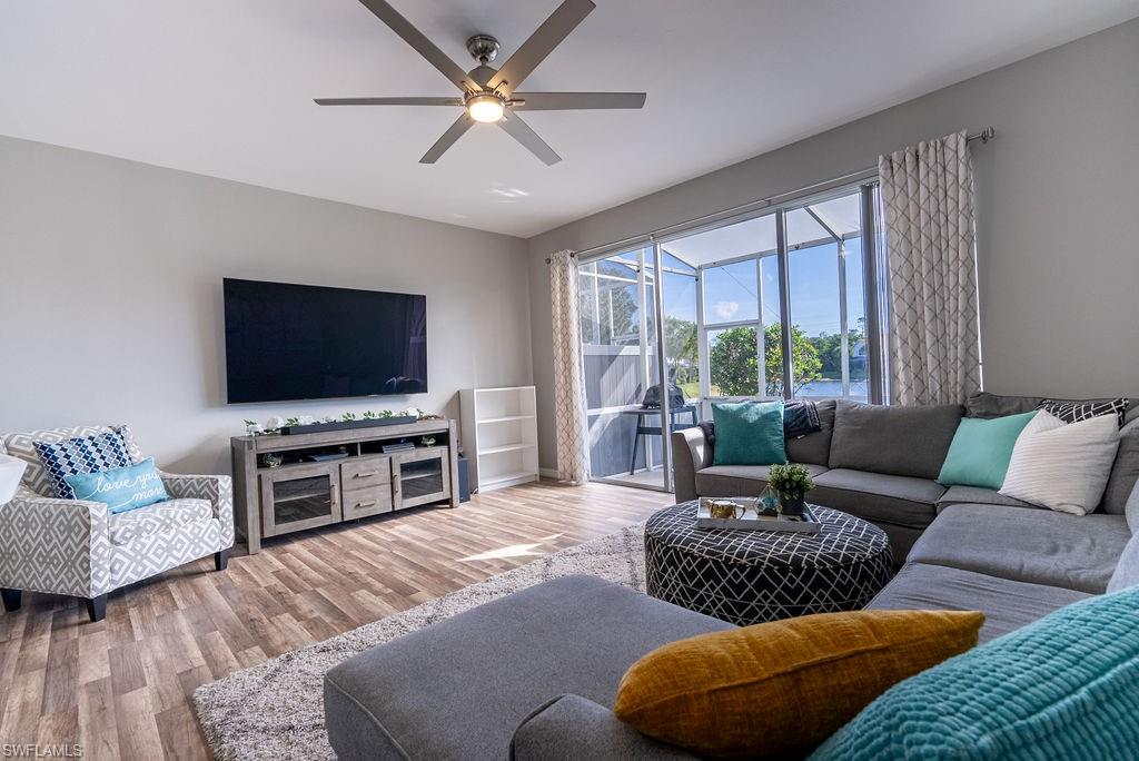 Living room featuring wood finished floors and ceiling fan