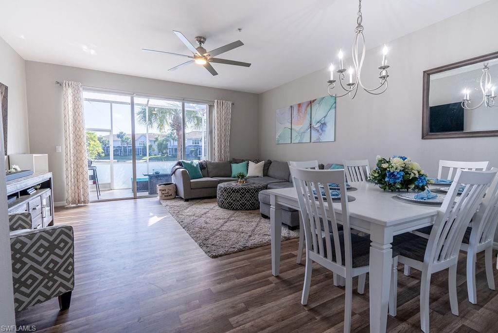 Dining area featuring wood finished floors and a ceiling fan