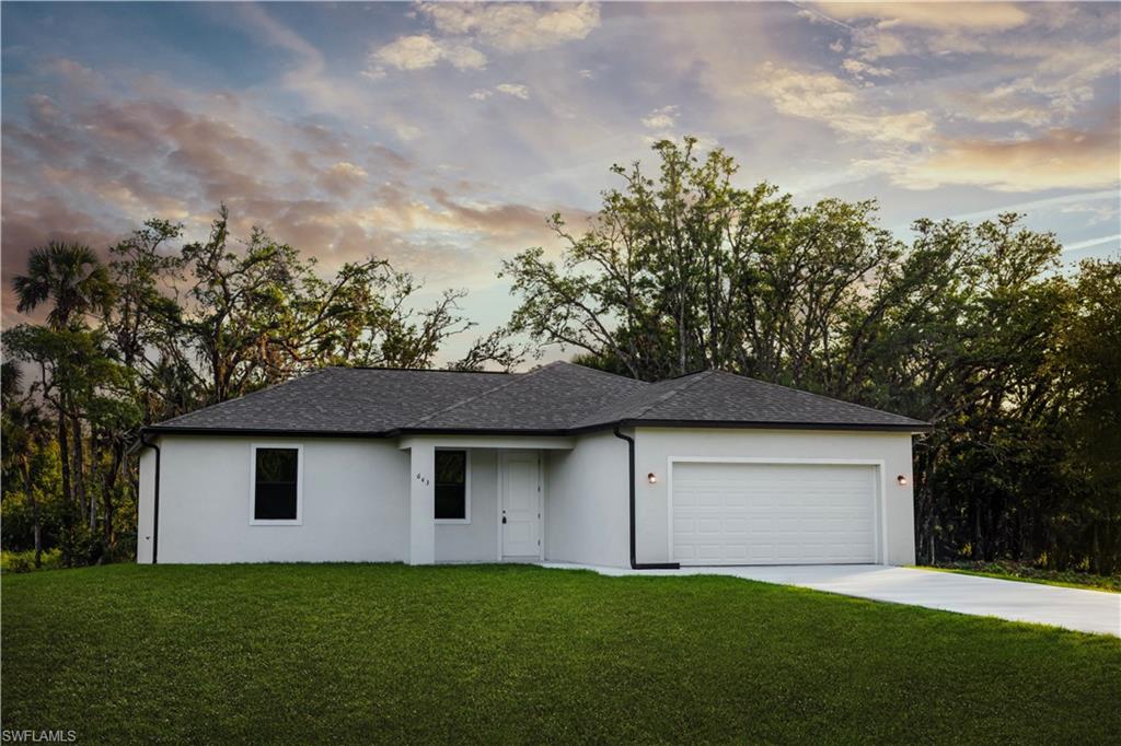 Contemporary single-story residence featuring a gray shingle roof and stucco exterior