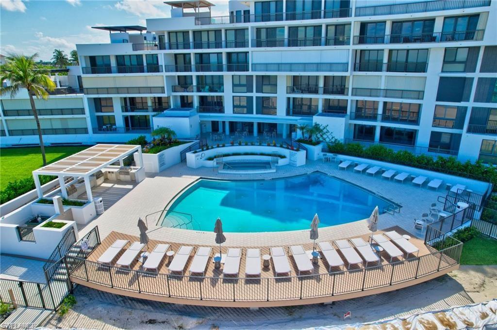 Brand new Community pool with a community hot tub, a patio, BBQs and steps to the beach