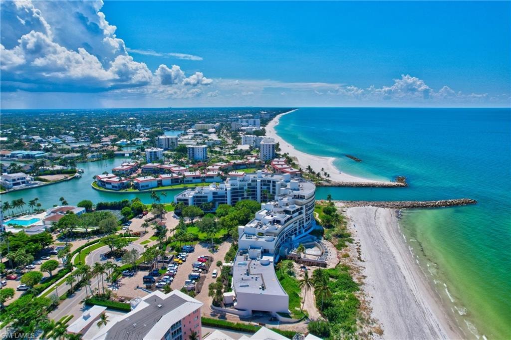 Aerial view of the Community with the Pool on the left with a view of the Bay and the Pass