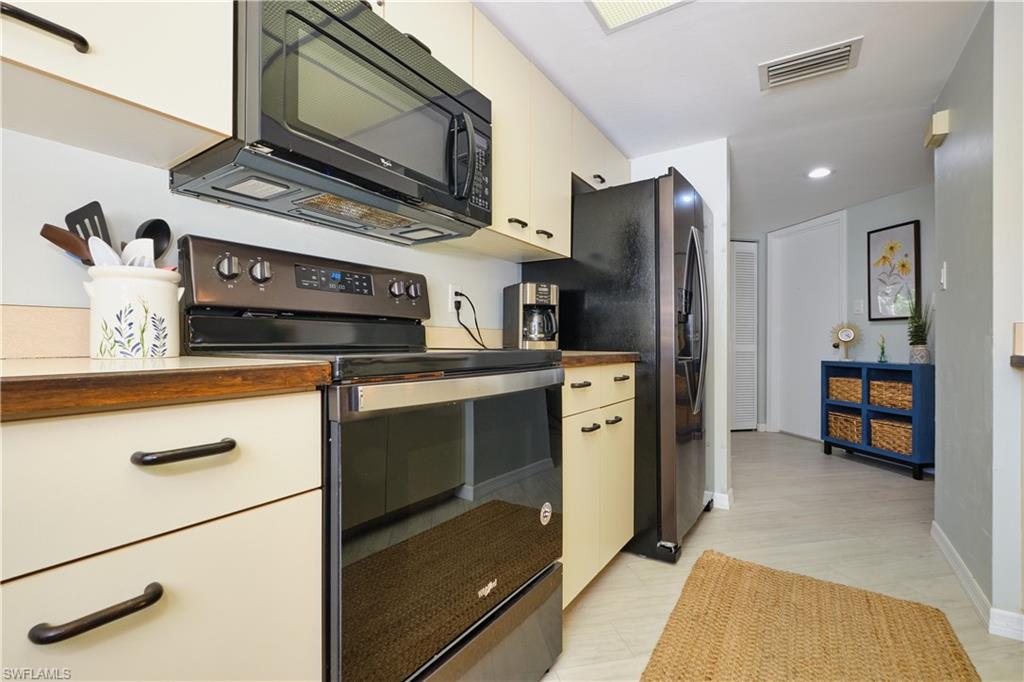 Kitchen featuring plenty of counter space, appliances with stainless steel finishes, and recessed lighting