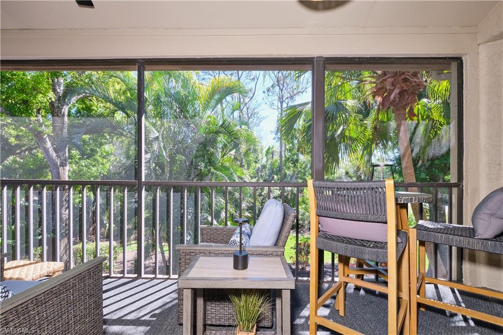 Enjoy your morning coffee in the serene setting of this screened lanai.