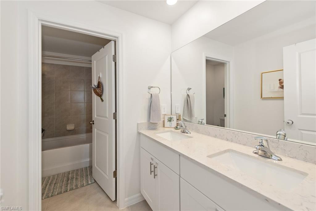 2nd Floor Bathroom features a dual sink vanity and tiled tub/shower