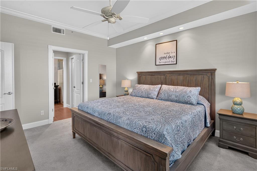Bedroom featuring light gray walls, plush gray carpeting, crown molding, and recessed lighting