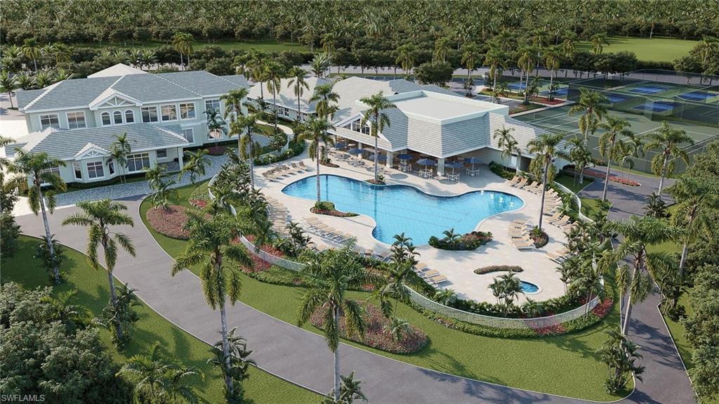Expansive resort-style pool area featuring a freeform swimming pool, integrated spa, and spacious surrounding patio