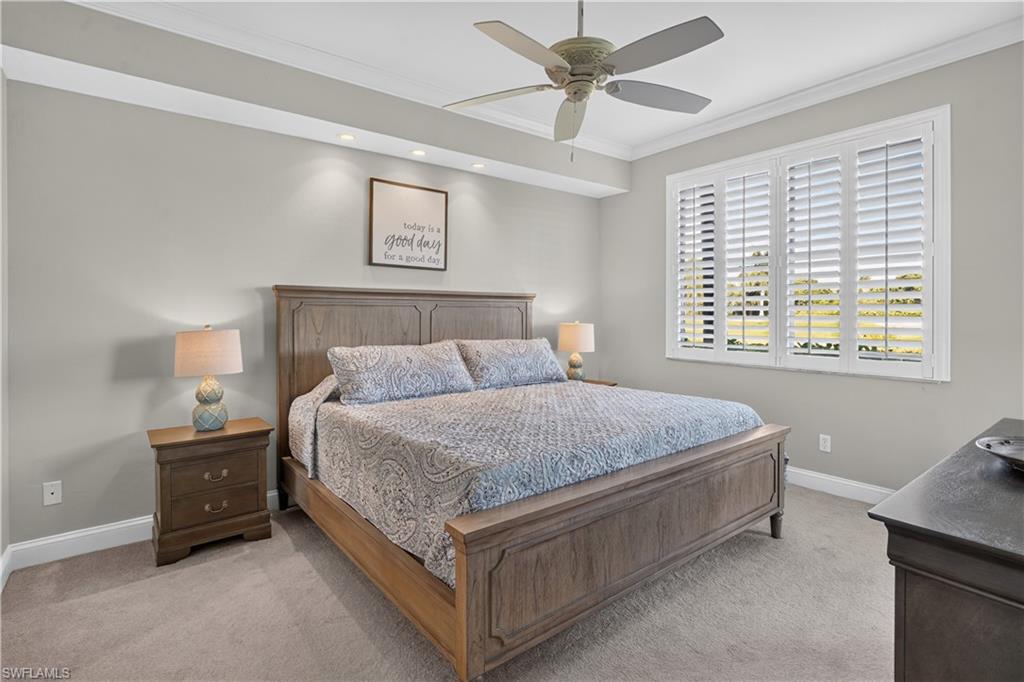 Carpeted room featuring a ceiling fan, recessed lighting, and crown molding