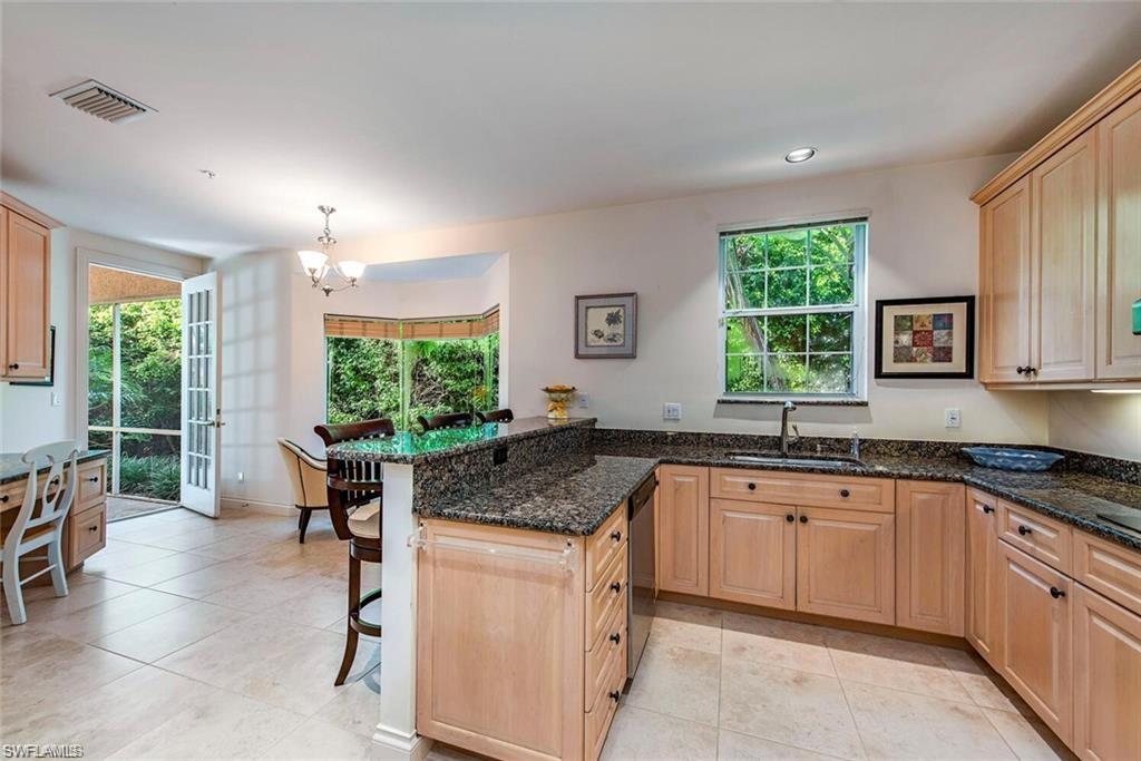 kitchen with breakfast bar and breakfast room