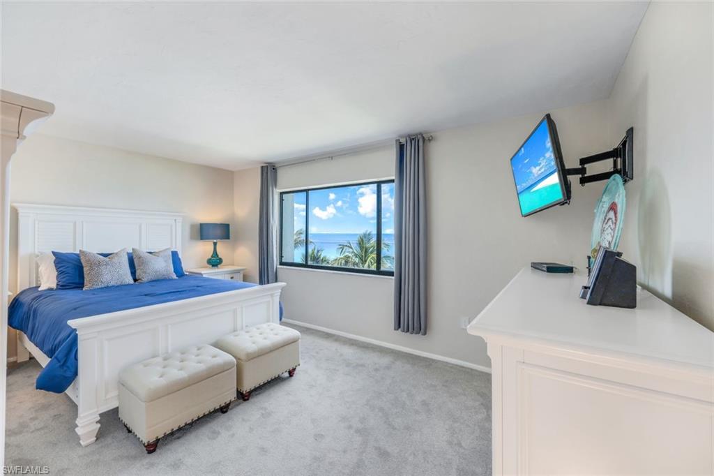 Bedroom with light colored carpet