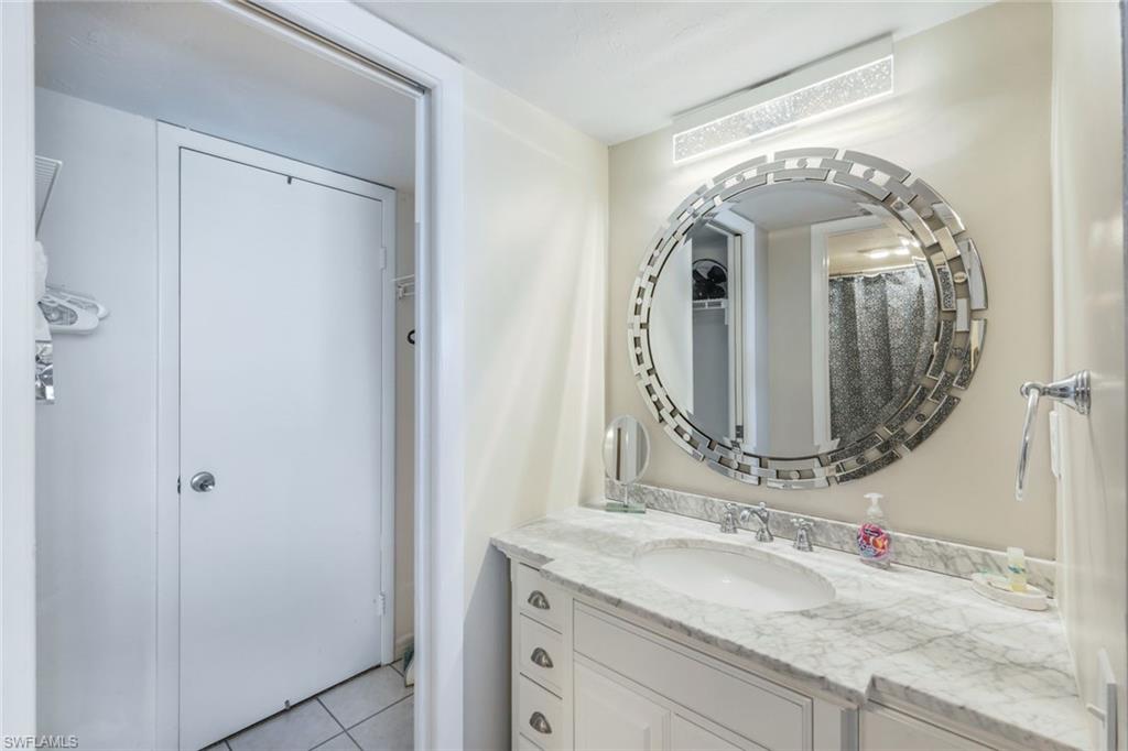 Bathroom with tile flooring and large vanity