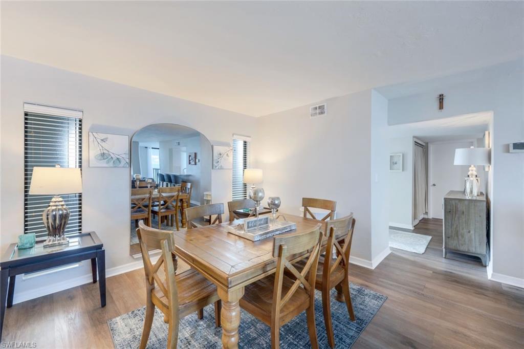 Dining space with wood-type flooring