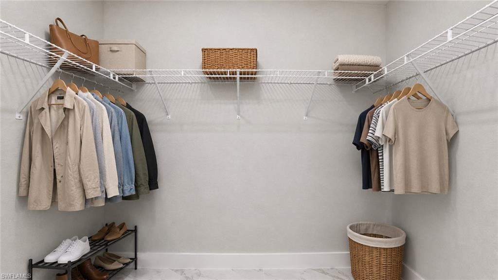 Organized walk-in closet featuring white wire shelving with multiple hanging rods, woven storage baskets, and dedicated shoe shelving