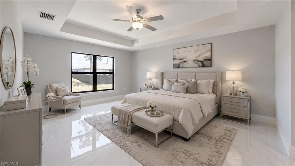 Spacious bedroom featuring polished tile flooring, tray ceiling with a built-in ceiling fan, and a large window with black framing