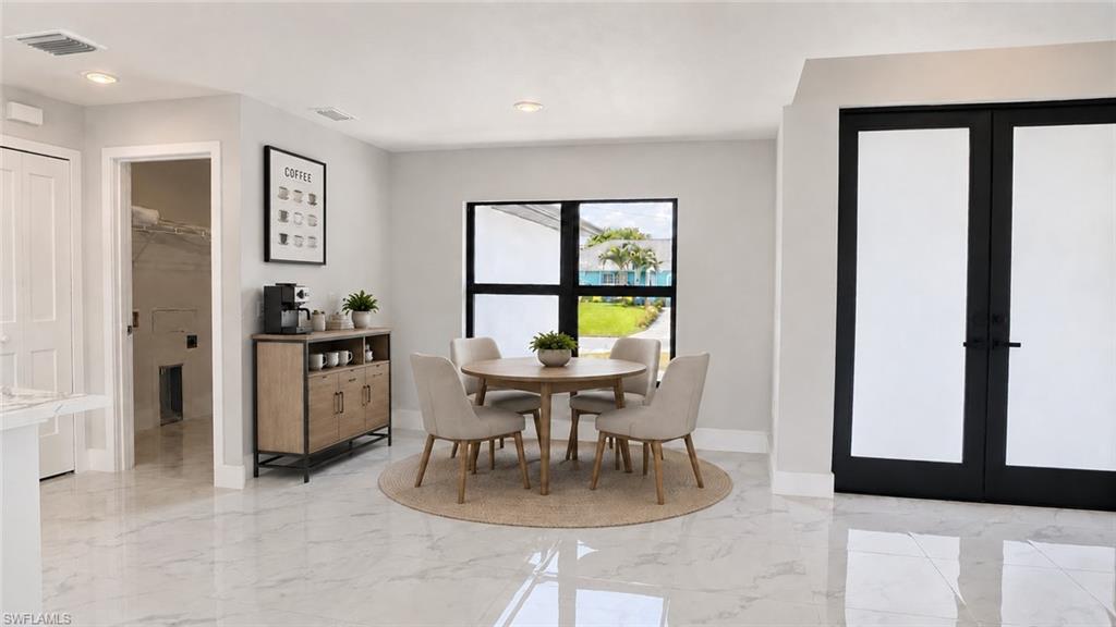 White tile flooring, recessed lighting, black frame window, and black frame double doors