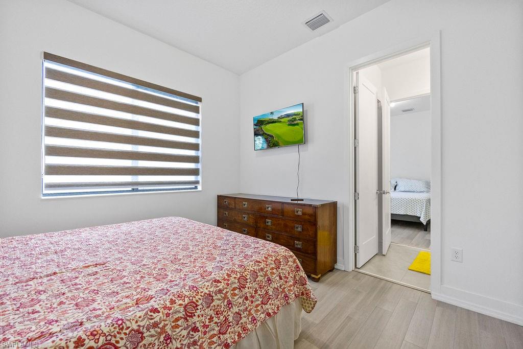 Bedroom with light wood-type flooring