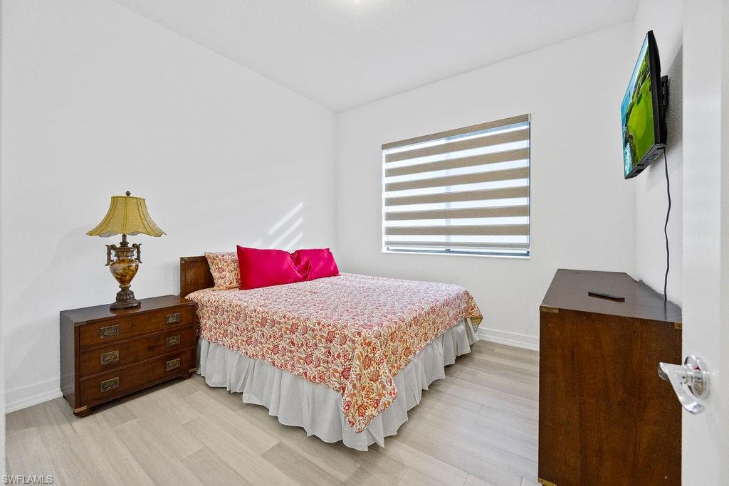 Bedroom featuring wood-type flooring