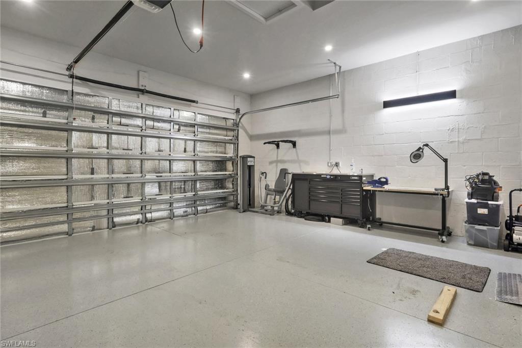 Generator, mini-split AC unit, insulation, and epoxy floor.