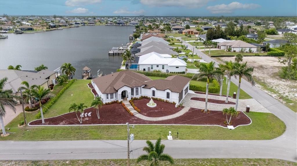 Aerial perspective of suburban area with a nearby body of water