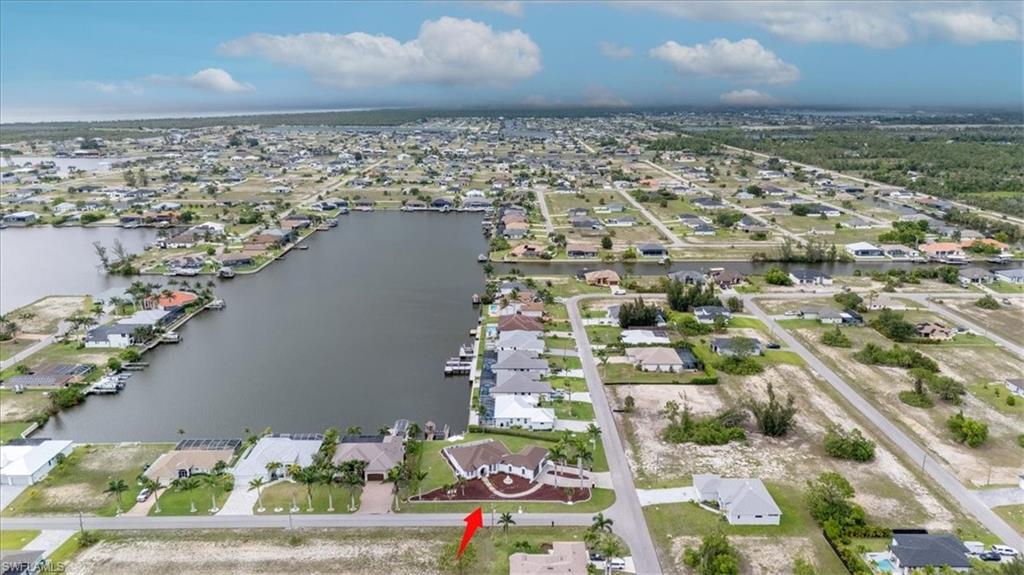 View of property location featuring nearby suburban area and a nearby body of water